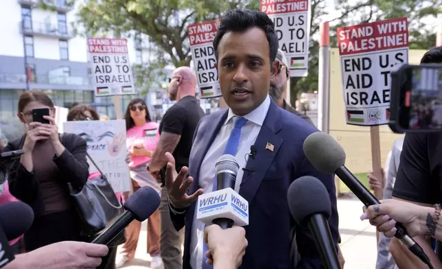 Former Republican presidential candidate and entrepreneur Vivek Ramaswamy talks to the media at demonstration near the Democratic National Convention Thursday, Aug. 22, 2024, in Chicago. (AP Photo/Alex Brandon)