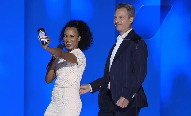 Kerry Washington, left, and Tony Goldwyn appear on stage during the Democratic National Convention Thursday, Aug. 22, 2024, in Chicago. (AP Photo/J. Scott Applewhite)