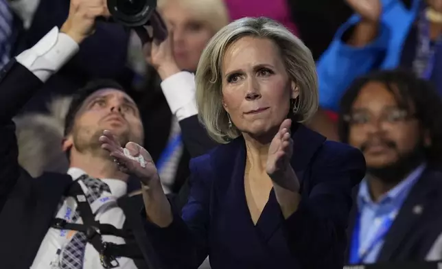 Gwen Walz claps as Democratic vice presidential nominee Minnesota Gov. Tim Walz speaks during the Democratic National Convention Wednesday, Aug. 21, 2024, in Chicago. (AP Photo/Matt Rourke)