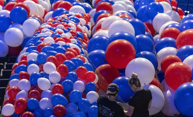 Balloons are staged to be raised to the ceiling as preparations are made before the upcoming Democratic National Convention, Thursday, Aug. 15, 2024, in Chicago. (AP Photo/Alex Brandon)