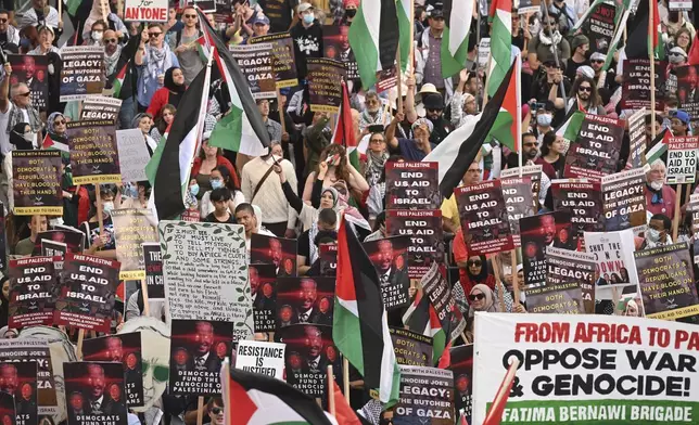 Protesters march during a demonstration outside the Democratic National Convention Wednesday, Aug. 21, 2024, in Chicago. (AP Photo/Noah Berger)