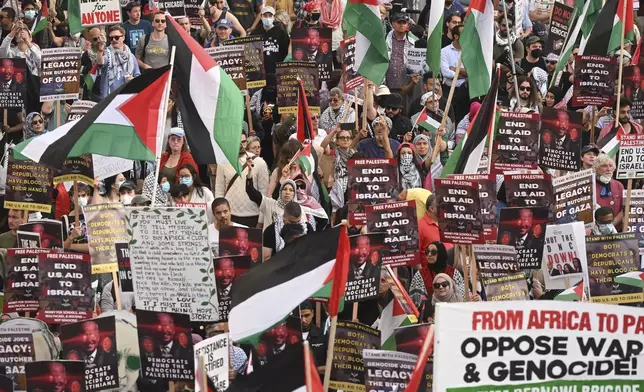 Protesters march during a demonstration outside the Democratic National Convention Wednesday, Aug. 21, 2024, in Chicago. (AP Photo/Noah Berger)