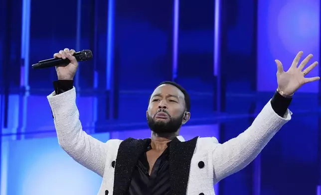 John Legend performs during the Democratic National Convention Wednesday, Aug. 21, 2024, in Chicago. (AP Photo/Brynn Anderson)