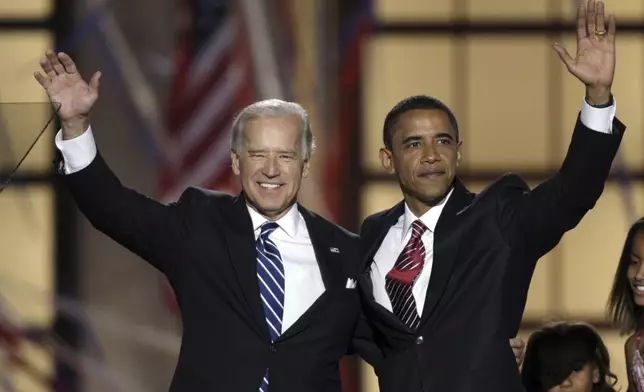 FILE - Democratic presidential nominee Sen. Barack Obama, D-Ill., left, and his running mate, Sen. Joe Biden, D-Del., wave after Obama's acceptance speech at the Democratic National Convention, Aug. 28, 2008, in Denver. (AP Photo/Ron Edmonds, File)