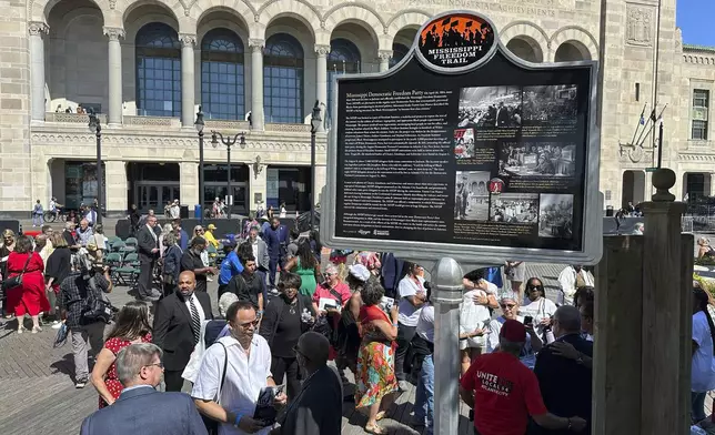 A newly unveiled Mississippi Freedom Trail marker on the boardwalk in front of Boardwalk Hall in Atlantic City, N.J., Tuesday, Aug. 20, 2024, commemorates Fannie Lou Hamer, a leader of the Mississippi Freedom Democratic Party, whose speech at the 1964 Democratic National Convention mesmerized the nation. (AP Photo/Ted Shaffrey)