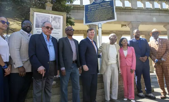 Elected officials and civil rights advocates unveil a Mississippi Freedom Trail marker on the boardwalk in Atlantic City, N.J., Tuesday, Aug. 20, 2024. From left: Tiyi Morris, daughter of civil rights advocate Euvestor Simpson; John Spann, Mississippi Humanities Council; Freedom Democrat Dave Dennis Sr.; Roy DeBerry of the Student Nonviolent Coordinating Committee; Mississippi Governor Tate Reeves; Ralph Hunter of the The African American Heritage Museum of Southern New Jersey; Tahesha Way, New Jersey Lieutenant Governor; Marty Small, Mayor of Atlantic City and Kaleem Shabazz, Atlantic City councilman. (AP Photo/Ted Shaffrey)