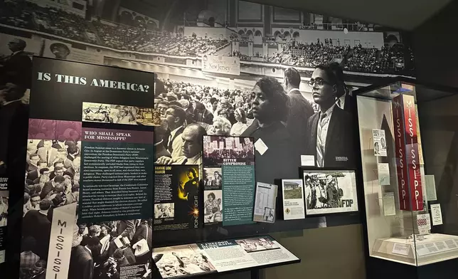 A collection of photographs from the 1964 Democratic National Convention on display inside the "I Question America" exhibit in the Mississippi Civil Rights Museum on Wednesday, Aug. 14, 2024, in Jackson, Miss. (AP Photo/Stephen Smith)