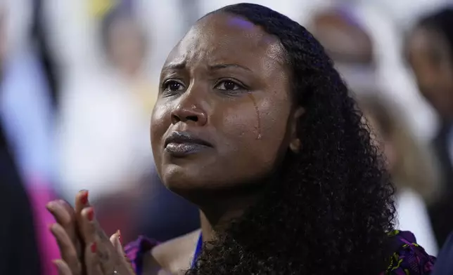 Pennsylvania delegate Dawn Chavous drops a tear as she listens to the members of The Exonerated Five, during the Democratic National Convention Thursday, Aug. 22, 2024, in Chicago. (AP Photo/Paul Sancya)