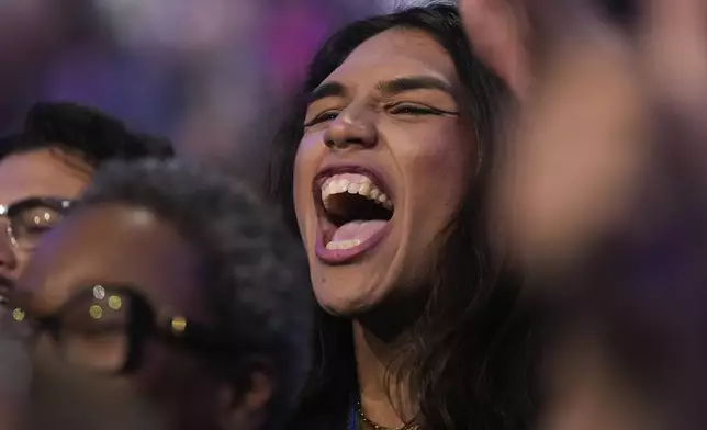 A delegate cheers during the Democratic National Convention Wednesday, Aug. 21, 2024, in Chicago. (AP Photo/Erin Hooley)