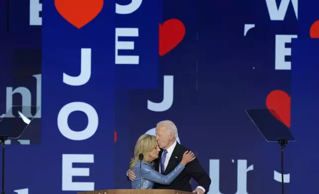 President Joe Biden kisses first lady Jill Biden after speaking at the Democratic National Convention on Monday, Aug. 19, 2024, in Chicago. (AP Photo/J. Scott Applewhite)