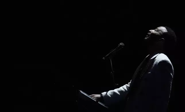 John Legend performs during the Democratic National Convention Wednesday, Aug. 21, 2024, in Chicago. (AP Photo/Brynn Anderson)