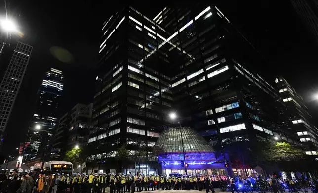 Police block the street during a demonstration near the Israeli Consulate during the Democratic National Convention Tuesday, Aug. 20, 2024, in Chicago. (AP Photo/Frank Franklin II)