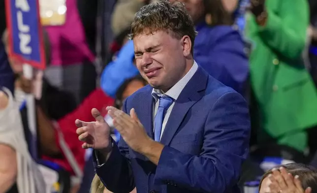 Gus Walz cries as Democratic vice presidential nominee Minnesota Gov. Tim Walz speaks during the Democratic National Convention Wednesday, Aug. 21, 2024, in Chicago. (AP Photo/Matt Rourke)