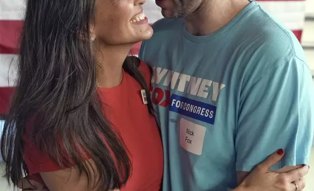 Whitney Fox, Democratic candidate for Florida's 13th congressional district, left, hugs her husband Nick Fox during her primary night election watch party Tuesday, Aug. 20, 2024, in Dunedin, Fla. (AP Photo/Chris O'Meara)