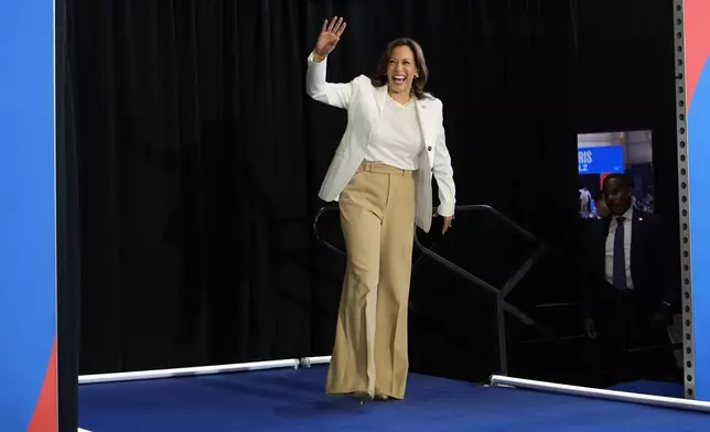 Democratic presidential nominee Vice President Kamala Harris arrives at a campaign rally Wednesday, Aug. 7, 2024, in Romulus, Mich. (AP Photo/Julia Nikhinson)