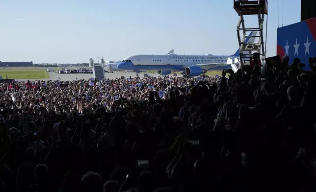 Air Force Two with Democratic presidential nominee Vice President Kamala Harris and her running mate Minnesota Gov. Tim Walz aboard arrive for a campaign rally Wednesday, Aug. 7, 2024, in Romulus, Mich. (AP Photo/Carlos Osorio)