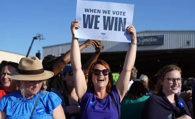 Supporters cheer as Democratic presidential nominee Vice President Kamala Harris and Democratic vice presidential candidate Minnesota Gov. Tim Walz arrive at a campaign rally Wednesday, Aug. 7, 2024, in Romulus, Mich. (AP Photo/Julia Nikhinson)