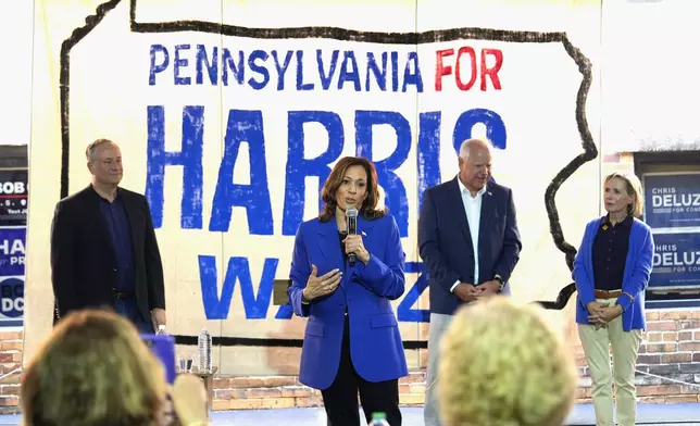 Democratic presidential nominee Vice President Kamala Harris speaks as second gentleman Doug Emhoff, from left, Democratic vice presidential nominee Minnesota Gov. Tim Walz and his wife Gwen Walz listen at a campaign event, Sunday, Aug. 18, 2024, in Rochester, Pa. (AP Photo/Julia Nikhinson)