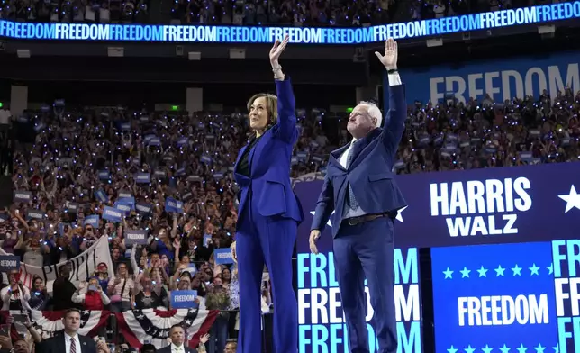 Democratic presidential nominee Vice President Kamala Harris and running mate Minnesota Gov. Tim Walz appear at the Fiserv Forum during a campaign rally in Milwaukee, Tuesday, Aug. 20, 2024. (AP Photo/Jacquelyn Martin)