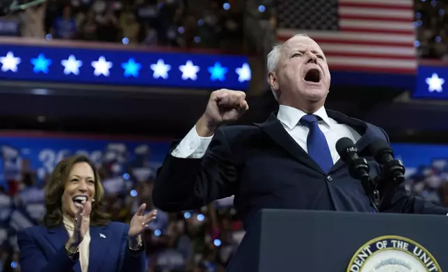 Democratic vice presidential nominee Minnesota Gov. Tim Walz and Democratic presidential nominee Vice President Kamala Harris speak at a campaign rally in Philadelphia, Tuesday, Aug. 6, 2024. (AP Photo/Matt Rourke)