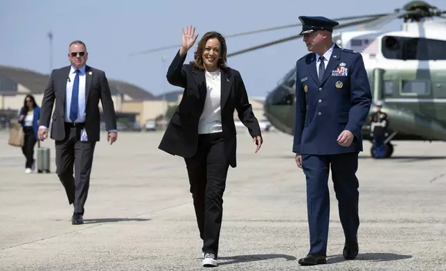 Democratic presidential nominee Vice President Kamala Harris boards Air Force Two at Joint Base Andrews, Md., Wednesday, Aug. 28, 2024, as she travels to Savannah, Ga., for a two-day campaign bus tour. (Saul Loeb/Pool via AP)