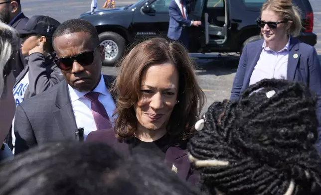 Democratic presidential nominee Vice President Kamala Harris greets supporters before boarding Marine Two at Soldier Field in Chicago, Friday, Aug. 23, 2024, en route to Washington after attending the Democratic National Convention. (AP Photo/Jacquelyn Martin)