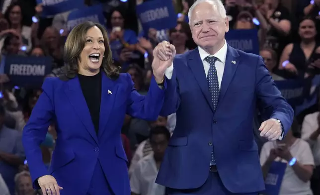 Democratic presidential nominee Vice President Kamala Harris and running mate Minnesota Gov. Tim Walz appear at the Fiserv Forum during a campaign rally in Milwaukee, Tuesday, Aug. 20, 2024. (AP Photo/Jacquelyn Martin)