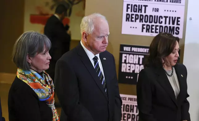 FILE - Rep. Betty McCullum, D-Minn., left, and Minnesota Governor Tim Walz, listen as Vice President Kamala Harris speaks at Planned Parenthood, March 14, 2024, in St. Paul, Minn. (AP Photo/Adam Bettcher, File)