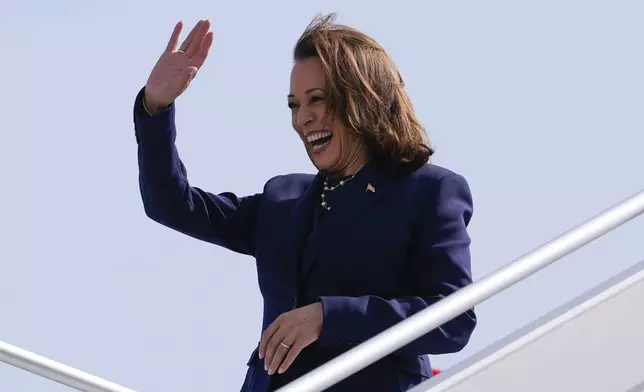 Vice President Kamala Harris waves to supporters during her arrival in Houston on Wednesday, July 31, 2024. (AP Photo/Mat Otero)