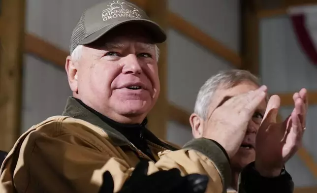 FILE - Minnesota Gov. Tim Walz applauds as President Joe Biden speaks at Dutch Creek Farms in Northfield, Minn., Nov. 1, 2023. (AP Photo/Andrew Harnik, File)