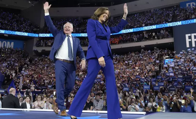 Democratic presidential nominee Vice President Kamala Harris and running mate Minnesota Gov. Tim Walz appear at the Fiserv Forum during a campaign rally in Milwaukee, Tuesday, Aug. 20, 2024. (AP Photo/Jacquelyn Martin)