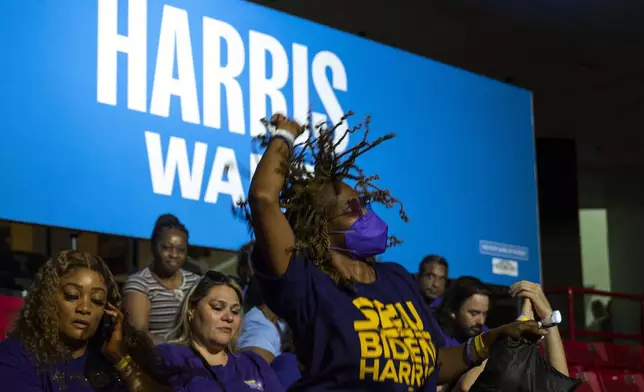 Supporters arrive before Democratic presidential nominee Vice President Kamala Harris speaks at a campaign rally with her running mate Tuesday, Aug. 6, 2024, at the Liacouras Center in Philadelphia. (AP Photo/Joe Lamberti)