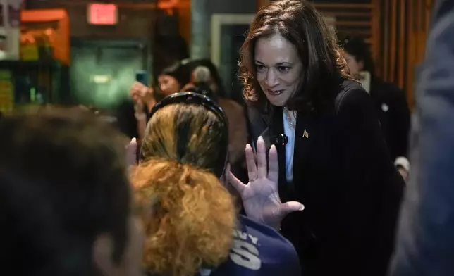 Democratic presidential nominee Vice President Kamala Harris talks as she visits SandFly Bar-B-Q in Savannah, Ga., Wednesday, Aug. 28, 2024. (AP Photo/Jacquelyn Martin)