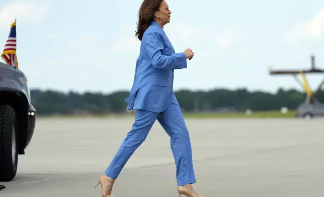 Democratic presidential nominee Vice President Kamala Harris walks to board Air Force Two at Raleigh-Durham International Airport, Friday, Aug. 16, 2024, in Morrisville, N.C., after a campaign event. (AP Photo/Julia Nikhinson)