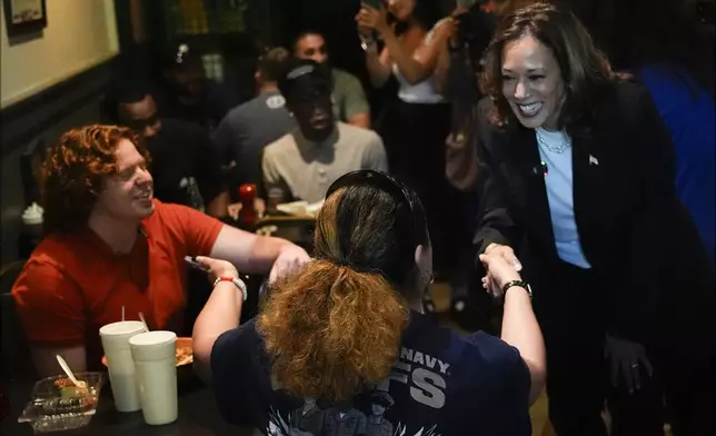 Democratic presidential nominee Vice President Kamala Harris talks as she visits SandFly Bar-B-Q in Savannah, Ga., Wednesday, Aug. 28, 2024. (AP Photo/Jacquelyn Martin)