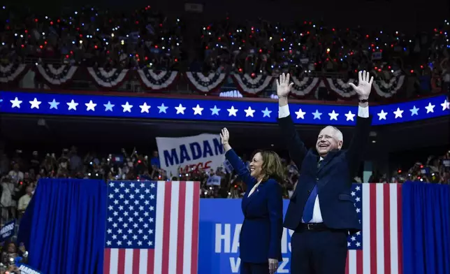 Democratic presidential nominee Vice President Kamala Harris and her running mate Minnesota Gov. Tim Walz arrive at a campaign rally in Philadelphia, Tuesday, Aug. 6, 2024. (AP Photo/Matt Rourke)