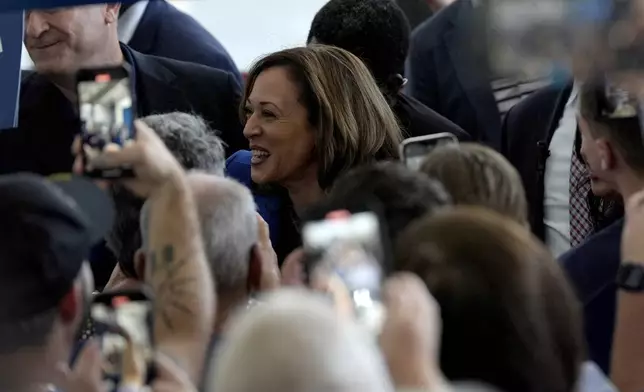 Democratic presidential nominee Vice President Kamala Harris greets supporters as she arrives at Pittsburgh International Airport, Sunday, Aug. 18, 2024, in Pittsburgh. (AP Photo/Julia Nikhinson)