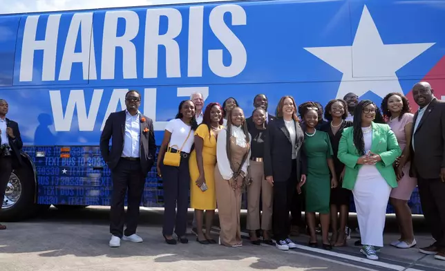 Democratic presidential nominee Vice President Kamala Harris pose for a photo with supporters at the Savannah/Hilton Head International Airport in Savannah, Ga., as before campaign events, Tuesday, Aug. 28, 2024. (AP Photo/Jacquelyn Martin)