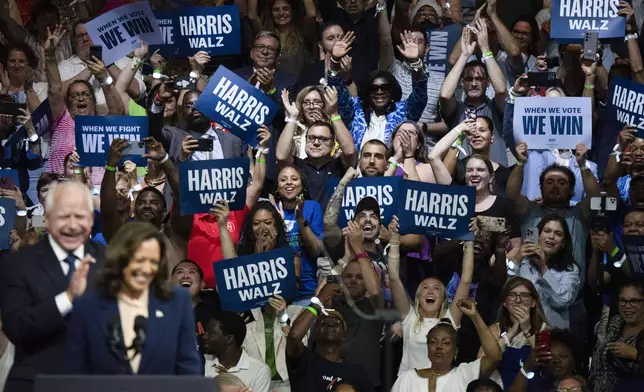 Democratic presidential nominee Vice President Kamala Harris and her running mate Minnesota Gov. Tim Walz speak at a campaign rally in Philadelphia, Tuesday, Aug. 6, 2024. (AP Photo/Joe Lamberti)