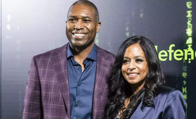 FILE - Maya Harris, right, and husband Tony West arrive at an event, Dec. 18, 2021, in San Francisco. (AP Photo/Noah Berger, File)