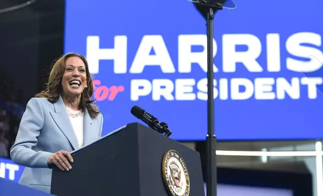 FILE - Vice President Kamala Harris speaks during a campaign rally, July 30, 2024, in Atlanta. Harris, the daughter of immigrants who rose through the California political and law enforcement ranks to become the first female vice president in U.S. history, is poised to secure the Democratic Party's presidential nomination Monday, Aug. 5, 2024. (AP Photo/John Bazemore, File)