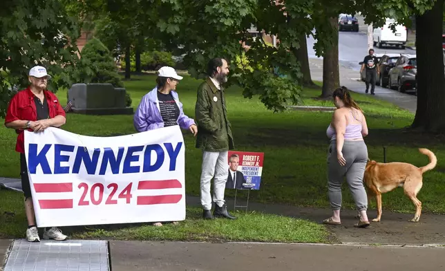 A small group of supporters wait for Independent presidential candidate Robert F. Kennedy Jr., to arrive at the Albany County Courthouse, Wednesday, Aug. 7, 2024, in Albany, N.Y. (AP Photo/Hans Pennink)