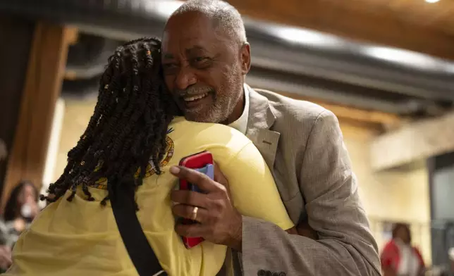 Former Minneapolis City Council member Don Samuels, right, greets supporters as he arrives to his primary night party Tuesday, Aug. 13, 2024, at the Canopy in Minneapolis. (Jeff Wheeler/Star Tribune via AP)