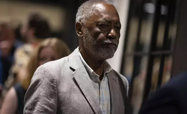 Former Minneapolis City council member Don Samuels walks with members of his campaign after the primary race for Minnesota's fifth congressional district is called for opponent Rep. Ilhan Omar during an election night watch party in Minneapolis, Tuesday, Aug. 13, 2024. (Ben Hovland/Minnesota Public Radio via AP)