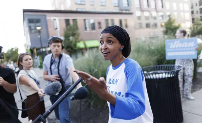 Rep. Ilhan Omar talks with media during a campaign stop in Minneapolis, Tuesday, Aug. 13, 2024. (Kerem Yücel/Minnesota Public Radio via AP)