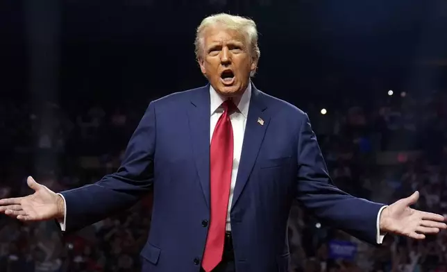 Republican presidential nominee former President Donald Trump gestures at a campaign rally at the Desert Diamond Arena, Friday, Aug. 23, 2024, in Glendale, Ariz. (AP Photo/Evan Vucci)