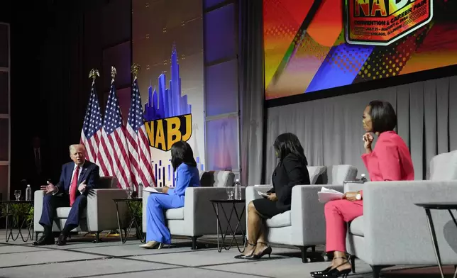 Republican presidential candidate former President Donald Trump, left, moderated by from left, ABC's Rachel Scott, Semafor's Nadia Goba and FOX News' Harris Faulkner, speaks at the National Association of Black Journalists, NABJ, convention, Wednesday, July 31, 2024, in Chicago. (AP Photo/Charles Rex Arbogast)