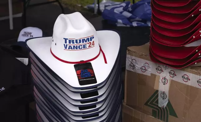 Merchandise is pictured before a campaign rally for Republican presidential nominee former President Donald Trump at the Mohegan Sun Arena at Casey Plaza in Wilkes-Barre, Pa., Saturday, Aug. 17, 2024. (AP Photo/Laurence Kesterson)