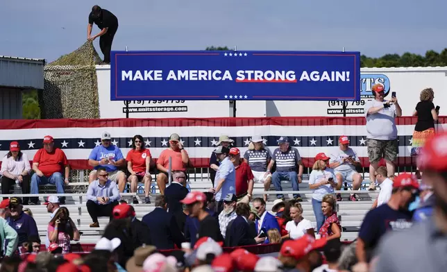 Supporters arrive to hear Republican presidential nominee former President Donald Trump speak at a rally, Wednesday, Aug. 21, 2024, in Asheboro, N.C. Trump is holding his first outdoor rally since narrowly surviving an attempted assassination when a a gunman opened fire in Pennsylvania last month. (AP Photo/Julia Nikhinson)