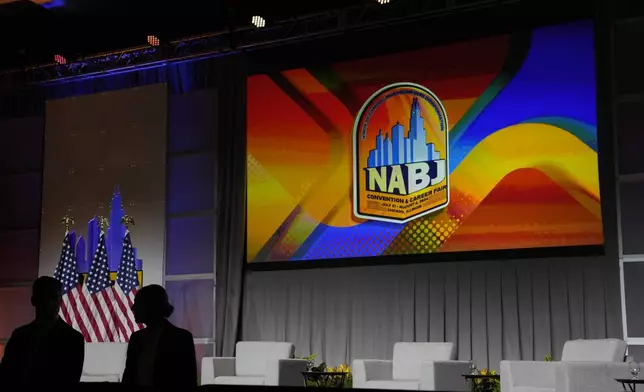 A Secret Service agents stands post in front of the stage ahead of Republican presidential candidate former President Donald Trump speaking at the National Association of Black Journalists, NABJ, convention, Wednesday, July 31, 2024, in Chicago. (AP Photo/Charles Rex Arbogast)